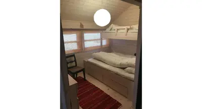 a small room with a bunk bed in a cabin at Venehovda - cabin at 1000 masl in Ål