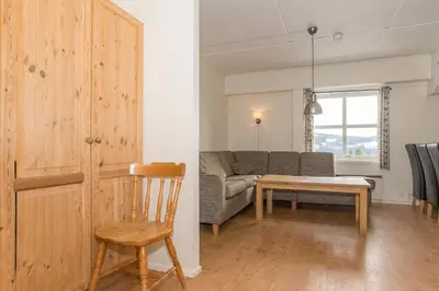 a living room with a couch and a table at Skitorget Apartments in Trysil
