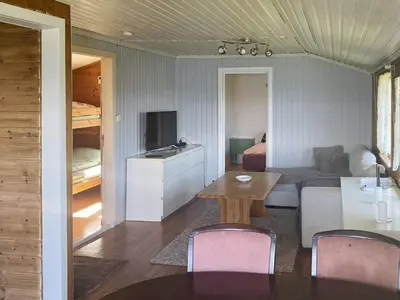 a living room with a room with a bed and a table at 4 person holiday home in LINDÅS-By Traum in Lindås