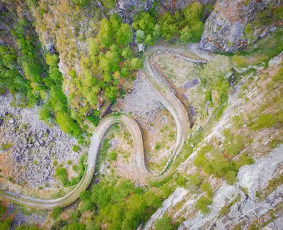 an aerial view of a winding road on a mountain at Husum Hotel in Borgund