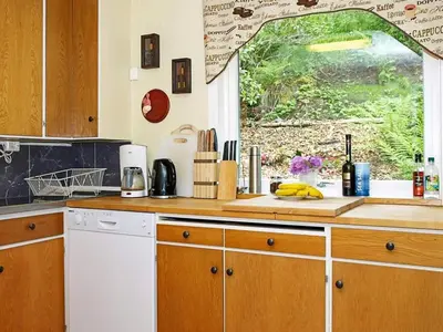a kitchen with a counter top with a window at 6 person holiday home in LONEVÅG-By Traum in Lonevåg