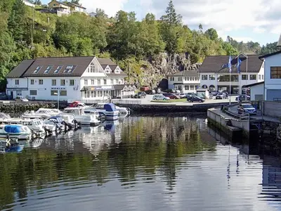 a group of boats are docked in a marina at 6 person holiday home in LONEVÅG-By Traum in Lonevåg