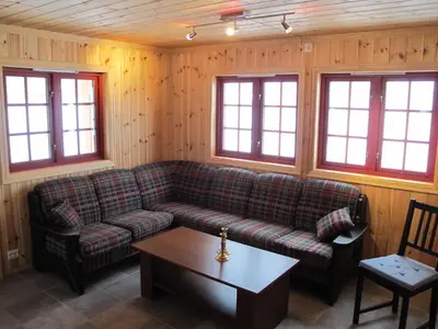 a living room with a couch and a coffee table at Hemsedal Høyfjellssenter in Hemsedal