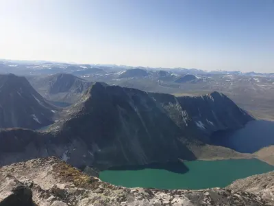 a view from the top of a mountain with a lake at Snøhetta Camping in Hjerkinn