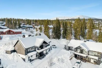 an aerial view of a home covered in snow at Nice apartment with Sauna and ski in out Trysil in Trysil