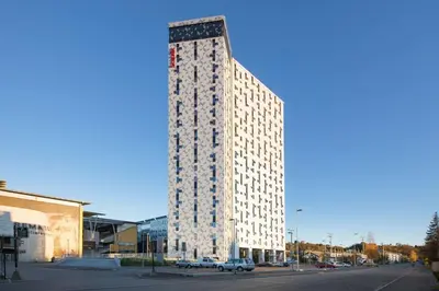 a tall building on the corner of a street at Scandic Lerkendal in Trondheim