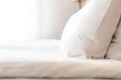 a close up of a white bed in a room at Scandic Lerkendal in Trondheim