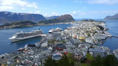 a city with a cruise ship in a harbor at Ålesund Urban - Spacious and luminous 100 m2 urban flat with 3 large bedrooms in Ålesund