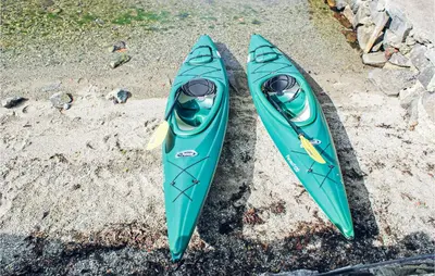 two kayaks sitting on the sand next to each other at Lovely Home In Hebnes With Wifi in Hebnes