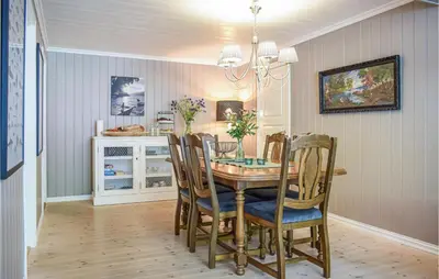 a dining room with a table and chairs at Lovely Apartment In Hebnes in Hebnes