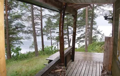 a porch of a cabin with a view of the water at Roligheten in Vanvik