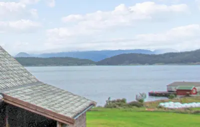 a view of a large body of water with a house at Holiday Home Bjoa Haugsgjerdet in Utbjoa