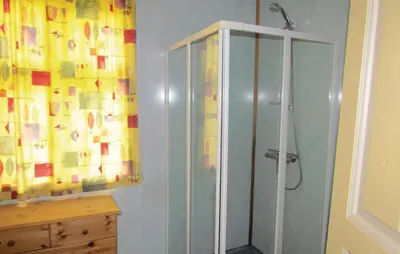 a bathroom with a shower and a glass cabinet at Holiday Home Bjoa Haugsgjerdet Ii in Utbjoa