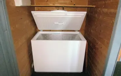 a white toilet in a room with a brick wall at 3 Bedroom Gorgeous Home In Bjoa in Utbjoa