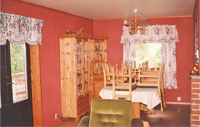 a dining room with a table and chairs at Holiday Home Etne Sørstranda in Erve