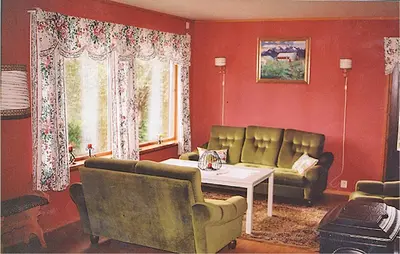 a living room with a couch and a table at Holiday Home Etne Sørstranda in Erve