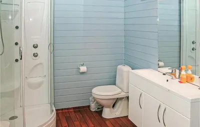 a bathroom with a toilet and a sink and a shower at Nice Home In Etne With House Sea View in Erve
