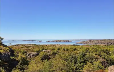 a view of the ocean from a bluff at Holiday Home Finnås Lyklingsjøvegen in Vinnes