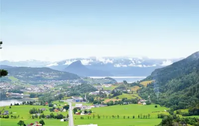 a view of a valley with a lake and mountains at Cozy Home In Norheimsund in Norheimsund
