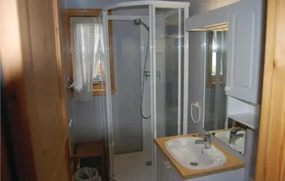 a bathroom with a shower and a sink at Cozy Apartment In Rosendal With Sauna in Rosendal
