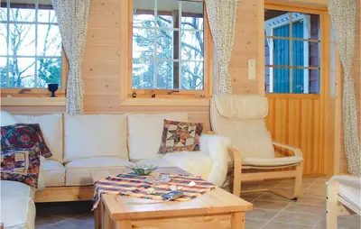 a living room with a couch and two chairs at 3 Bedroom Beautiful Home In Hatlestrand in Hatlestrand