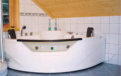 a bath tub in a bathroom with at 3 Bedroom Beautiful Home In Hatlestrand in Hatlestrand