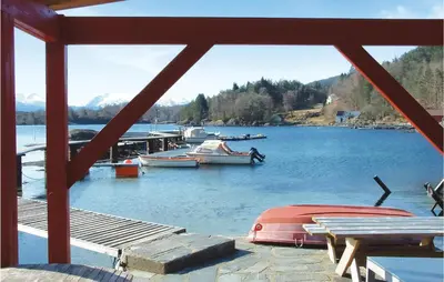 a view of a lake with boats in the water at Beautiful Home In Hatlestrand in Hatlestrand