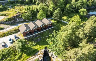 an aerial view of a house on a hill at Beautiful Home In Hatlestrand in Hatlestrand