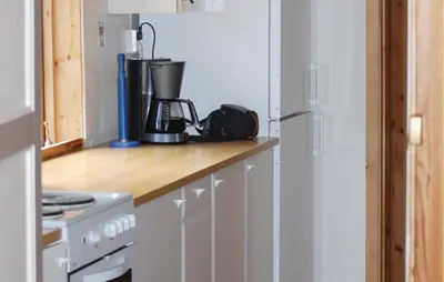 a kitchen counter with a blender on top of it at Holiday Home Tysse Eikedal in Tysse