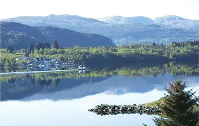 a view of a lake with trees and mountains at Holiday Home Sørbøvåg Sandnes in Sandnes