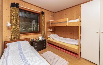 a bedroom with two bunk beds and a window at Beautiful Home In Jostedal With Kitchen in Jostedal