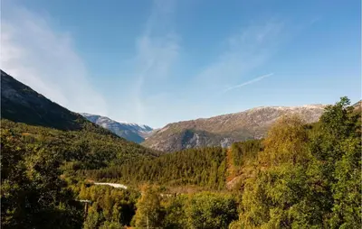 a view of a valley with trees and mountains at Beautiful Home In Jostedal With Kitchen in Jostedal