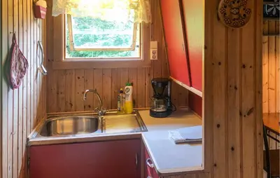 a small kitchen with a sink and a window at Holiday Home Olden Gjerde in Olden