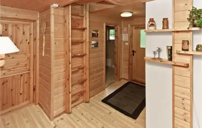 a room with wood paneling and a hallway at Glomnes Nr 2 in Hjelle