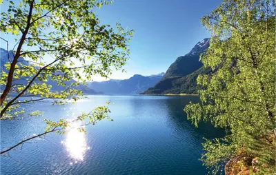 a view of a lake with mountains in the background at Glomnes Nr 2 in Hjelle