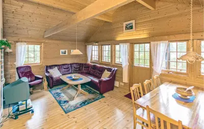 a living room with a couch and a table at Glomnes Nr 2 in Hjelle