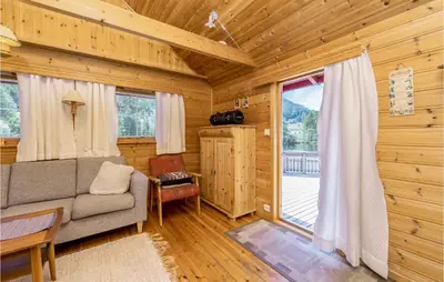 a living room with a couch and a window at 3 Bedroom Amazing Home In Sandane in Sandane
