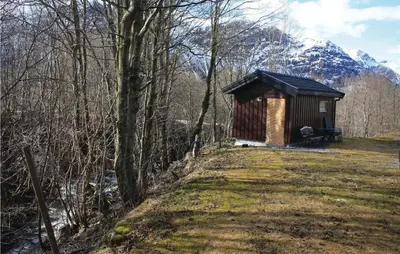 a small cabin in the middle of a forest at Holiday Home Isfjorden Isfjorden in Isfjorden