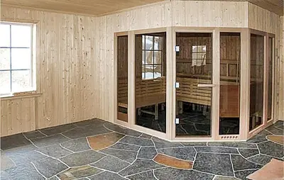 an empty room with wooden walls and a stone floor at Amazing Home In Trysil With Sauna in Trysil