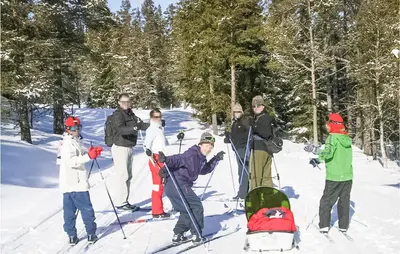 a group of people on skis in the snow at Holiday Home Gålå Peer Gyntlia in Gålå