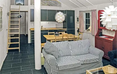 a living room with a couch and a table at Holiday Home Gålå Peer Gyntlia Ii in Gålå