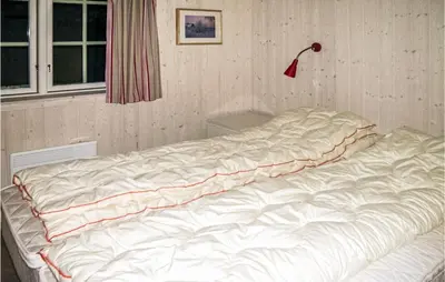 a large white bed in a corner of a room at Holiday Home Gålå Peer Gyntlia Iii in Gålå