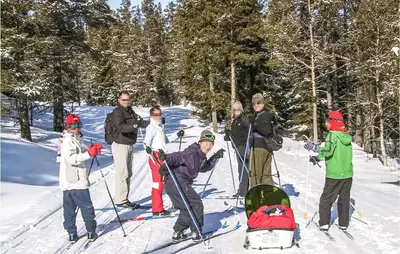 a group of people on skis in the snow at Holiday Home Gålå Peer Gyntlia Iv in Gålå