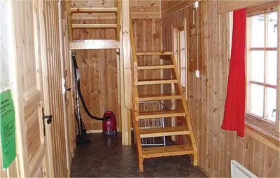 a room with a book shelf and a ladder at Holiday Home Ringebu Måsåplassen Ii in Ringebu