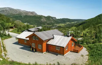 an aerial view of a house in a mountain at Skarsnuten in Hemsedal