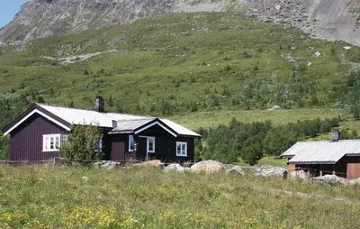 a house on a hill in front of a mountain at Beautiful Home In Hemsedal With Kitchen in Hemsedal