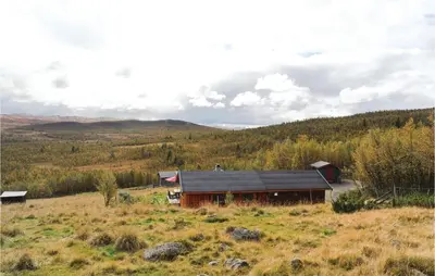 a barn in the middle of a field at Tallåsen Dagalifjell in Uvdal