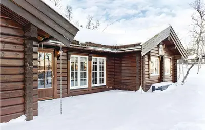 a log cabin in the snow at Holiday Home Flå Øvre Reinsjøfjell in Flå