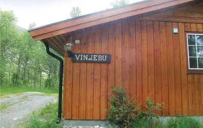 a building with a sign on the side of it at Vinjebu in Hemsedal