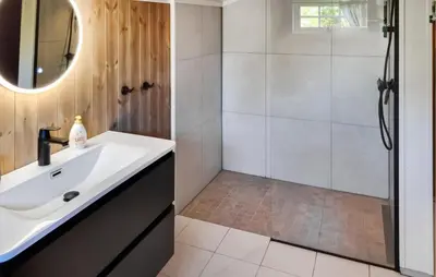 a bathroom with a sink and a shower at Månebu in Nesbyen
